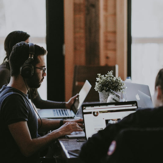 Group of people working on their laptops.