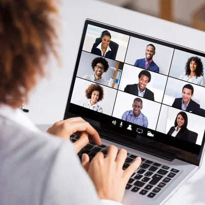 Woman on webinar call with other people.
