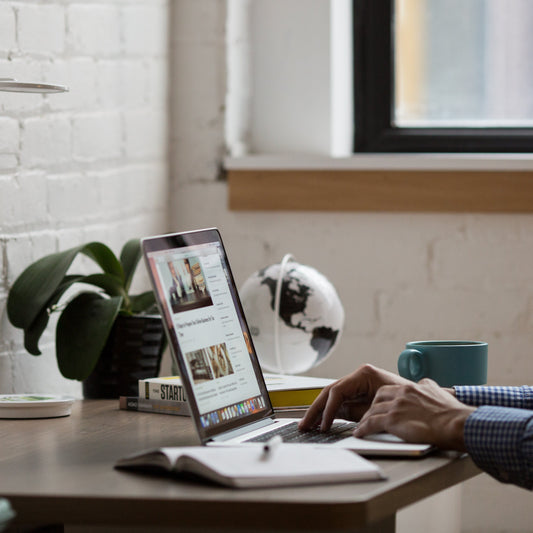 Man researching on laptop.