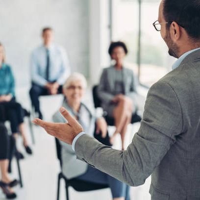Man giving a speech to a audience