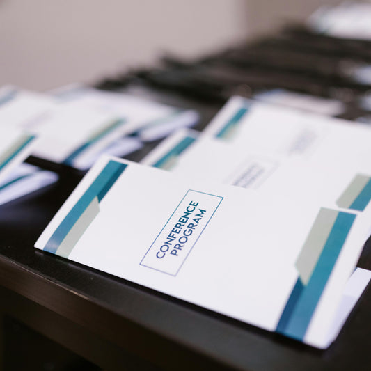 Conference program brochures on a table